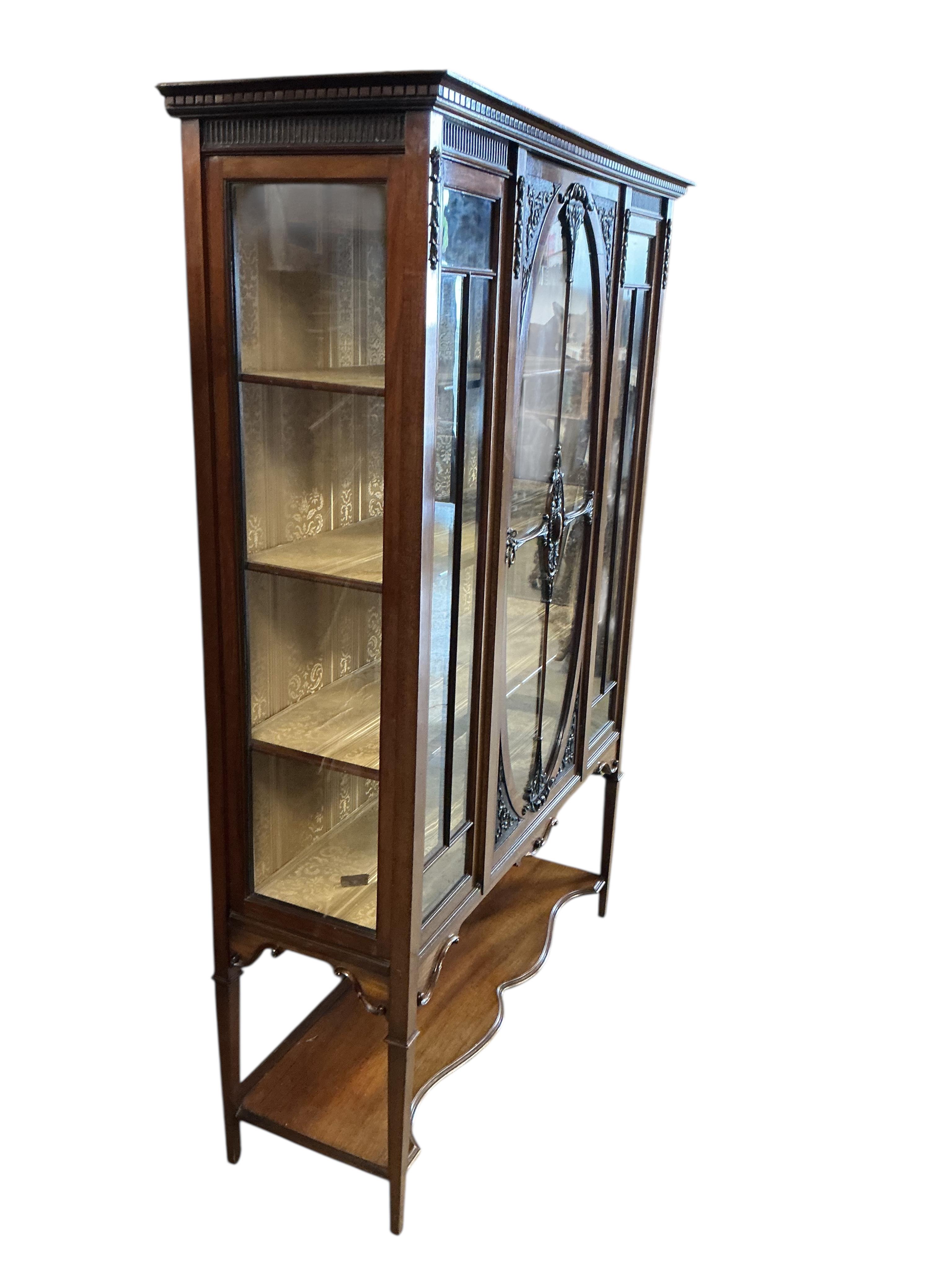 A late Victorian mahogany display cabinet, width 123cm, depth 43cm, height 180cm.